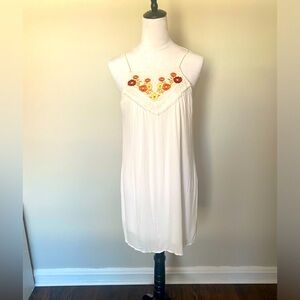 Francesca’s white flowy dress with flower detail, size M